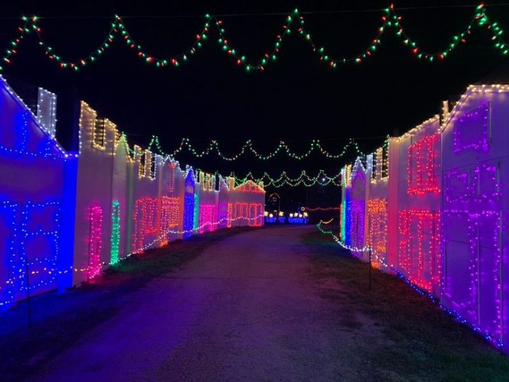 facade of houses lit up with colorful lights